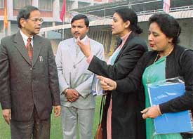 Teachers discuss a point with the Panjab University Vice-Chancellor, Prof K.N. Paaathak, on the concluding day of an orientation camp in Ludhiana 