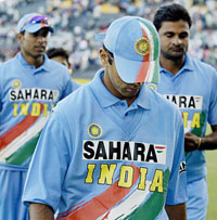 India�s Rahul Dravid hangs his head along side team-mates Yuvraj Singh and Javagal Srinath as they walk off the field after their loss to New Zealand by five wickets in the third one-day international in Christchurch on Wednesday. 