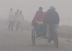 A rickshaw makes headway where cars seemed to falter