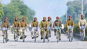 Policemen patrol on bicycles after the launch of this pattern of patrolling in SAS Nagar 
