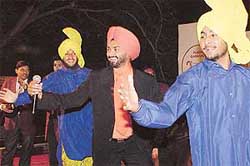 Gurpal Surapuri (centre) performs at The Tribune sponsored Plaza Carnival