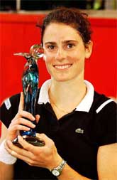 French winner Nathalie Dechy holds her trophy after beating Swiss Marie-Gaianeh Mikaelian 