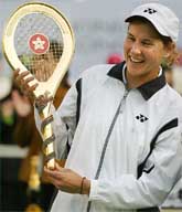 Monica Seles of the USA receives a golden racket after defeating fellow country woman Chanda Rubin in the final of Hong Kong Ladies Challenge