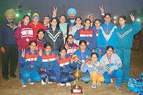 The Punjab women�s kho-kho team poses with the trophy after winning the 38th Senior National Kho-Kho Championship 