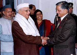 Uttaranchal Chief Minister N.D. Tiwari congratulating newly appointed U.P Governor Sudarshan Aggarwal 