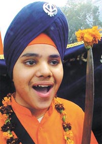 A boy during the Nagar Kirtan on the eve of the Prakash Utsav of Guru Gobind Singh ji at Connaught Place