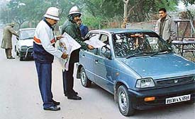 Policemen distribute road-safety literature in Chandigarh