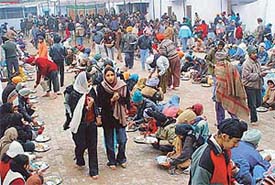 Devotees partake of langar in a gurdwara on the occasion of Guru Gobind Singh�s birth anniversary