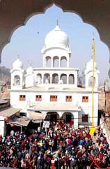 Devotees listen to Head Granthi on the occasion of the birth anniversary celebrations of Guru Gobind Singh