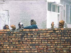 The wall being reconstructed at the same place where it was demolished in New Kirpal Nagar