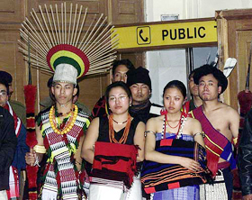 Naga youths wait at IGI airport