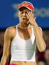 Slovakia's Daniela Hantuchova reacts after hitting the ball