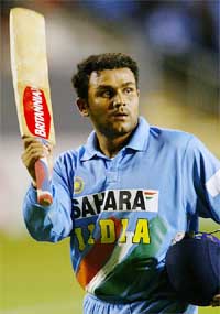 India's Virender Sehwag waves his bat towards the crowd