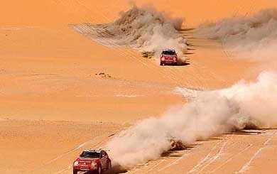 Mitsubishi teammates Hiroshi Masuoka of Japan and Stephane Peterhansel of France