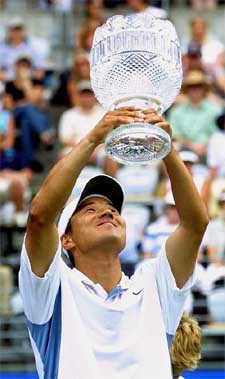 Lee Hyung-taik of South Korea holds his trophy