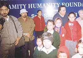 Kids watching the movie Makdee, organised by Amity Humanity Foundation and Delhi Department of Social Welfare