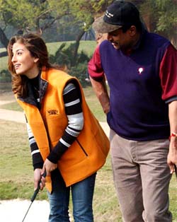 Cricketer-turned-golfer Kapil Dev with film actress and model Perizaad Zorabian 