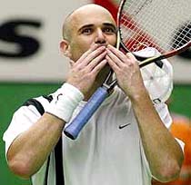 Andre Agassi of the United States acknowledges the cheers of fans