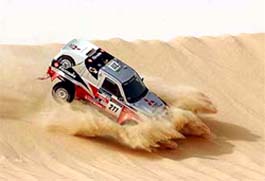 Portugal's Carlos Sousa and French co-driver Henri Magne steer their Mitsubishi in the Egyptian desert