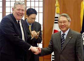 US Assistant Secretary of State James Kelly shakes hand with South Korean Foreign Minister 