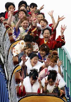 Young women dressed in traditional kimonos celebrate the Coming of Age Day