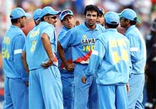 India bowler Zaheer Kahn, center, is congratulated by his teammates after taking the wicket of Craig McMillan 