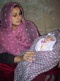 An Afghan woman, Lila, sits in a prison