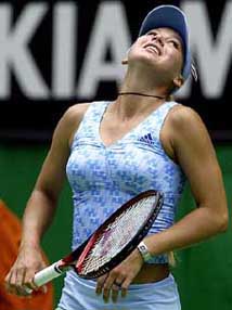Anna Kournikova of Russia reacts after hitting the ball