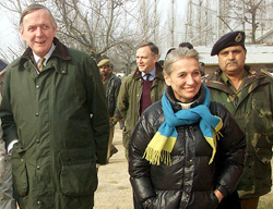 British High Commissioner to India Sir Rob Young walks behind his wife