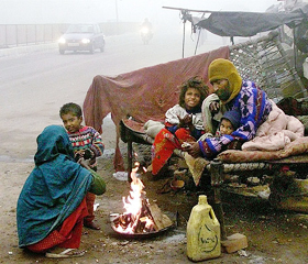 Slum dwellers prepare a meal