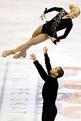 Stephanie Kalesavich is tossed in the air by Aaron Parchem