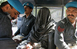Pakistani police escorts Rizwan Basheer to an anti-terrorist court in Karachi 