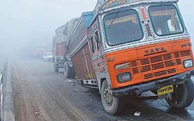 Traffic on the busy Chandigarh-Ambala road had to be diverted on Friday morning as a truck driver blinded by fog hit the railing of a bridge over the Ghaggar and two wheels of the truck came off