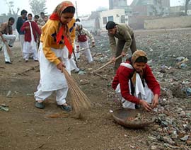 The students of Punjab Public School sweep and clean the place near their school