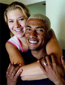 Brazilian soccer player Kleberson poses with his girlfriend