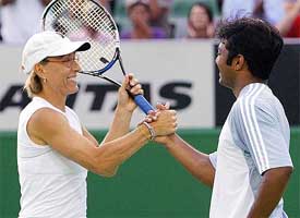 Martina Navratilova of the USA shakes hand with mixed doubles partner Leander Paes of India following their first round victory 