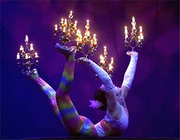 A member of the Chinese Circus balances candles while performing her "Zensantion" number in Palma de Mallorca