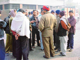 Police personnel question relatives of the two labourers who died under mysterious circumstances at Focal Point