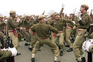Home Guard jawans dance on a cold morning during a rehearsal for the Republic Day parade