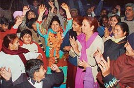 Ms Seema Chaudhary and her supporters celebrate victory