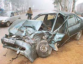 The mangled remains of a car that collided with a Tata Sumo