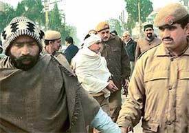 The police rounds up a few persons caught casting ��fake�� votes