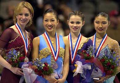 Silver medalist Sarah Hughes, gold medalist Michelle Kwan, bronze medallist Sasha Cohen and pewter medalist Ann Patrice McDonough stand on the podium