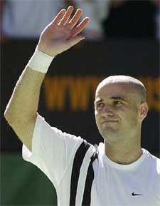 Andre Agassi of the USA waves after defeating Guillermo Coria of Argentina