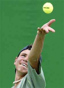 Sergey Bubka of the Ukraine serves during his match
