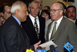 Iraqi President Saddam Hussein�s top adviser Amir al-Saddi stands next to U.N. Chief Inspector Hans Blix after ending talks in Baghdad