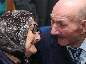Hungary's oldest woman, 109-year-old Rozalia Foeldes listens to her 92-year-old son Sandor Csiki on her birthday party
