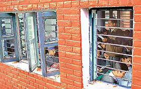 Children study in classes with broken windowpanes in a government school in Chandigarh.