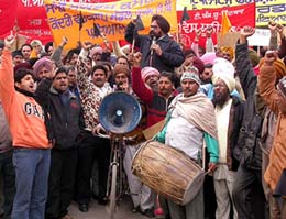 Employees of the Punjab State Electricity Board (central workshop) raise slogans out
