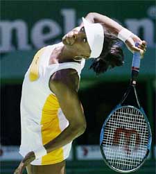 Venus Williams of the United States serves to Daniela Hantuchova